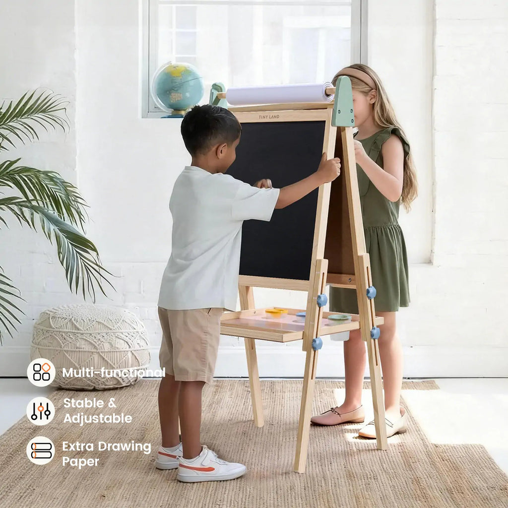Child painting on Tiny Land art easel outdoors
Tiny Land easel showing full set of drawing tools included