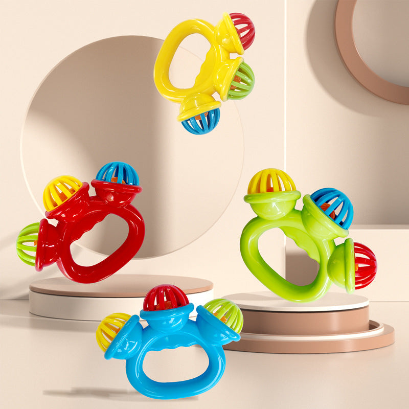 Baby handbell rattle toys in blue, red, yellow, and green with easy-grip ring handles for infant sensory play