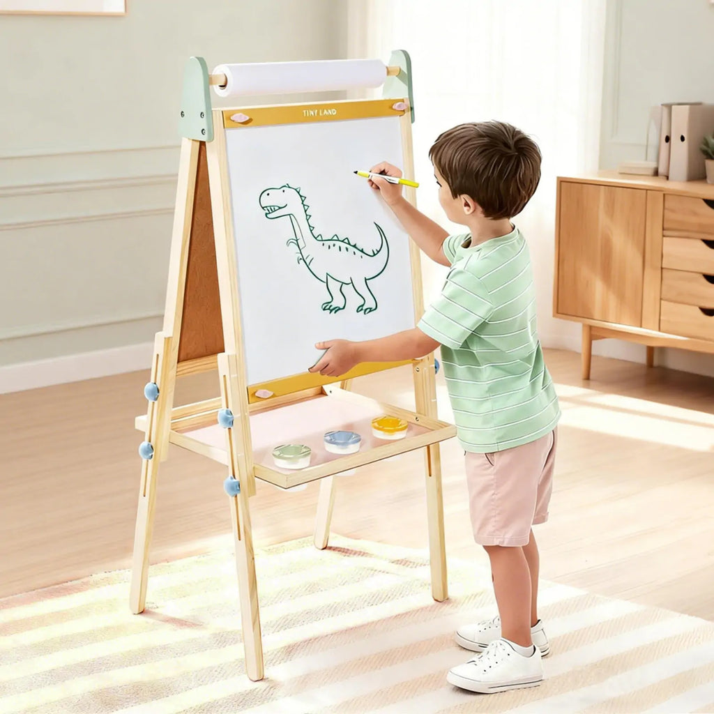 Child painting on Tiny Land art easel outdoors
Tiny Land easel showing full set of drawing tools included