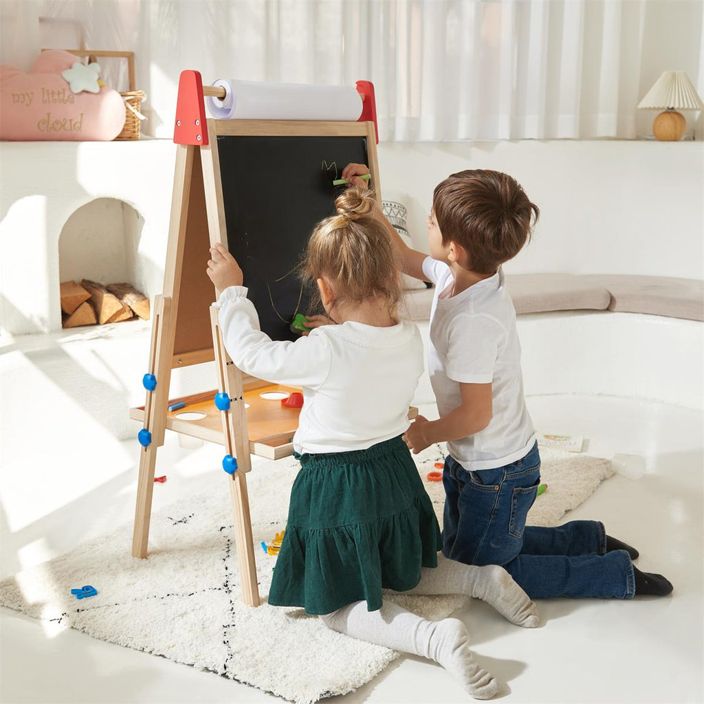 Child painting on Tiny Land art easel outdoors
Tiny Land easel showing full set of drawing tools included