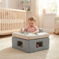 Baby playing with Neo Geometric Baby Activity Center featuring high-contrast geometric shapes and sensory toys