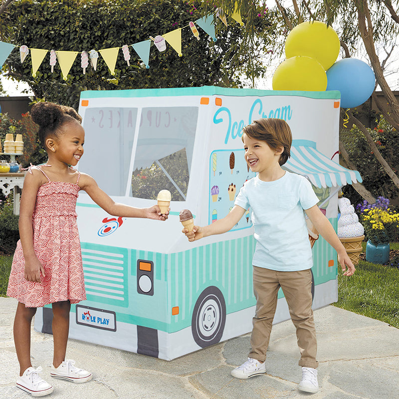 Kids playing outside with Ice Cream Truck Kids Playhouse showing colorful ice cream graphics and service window