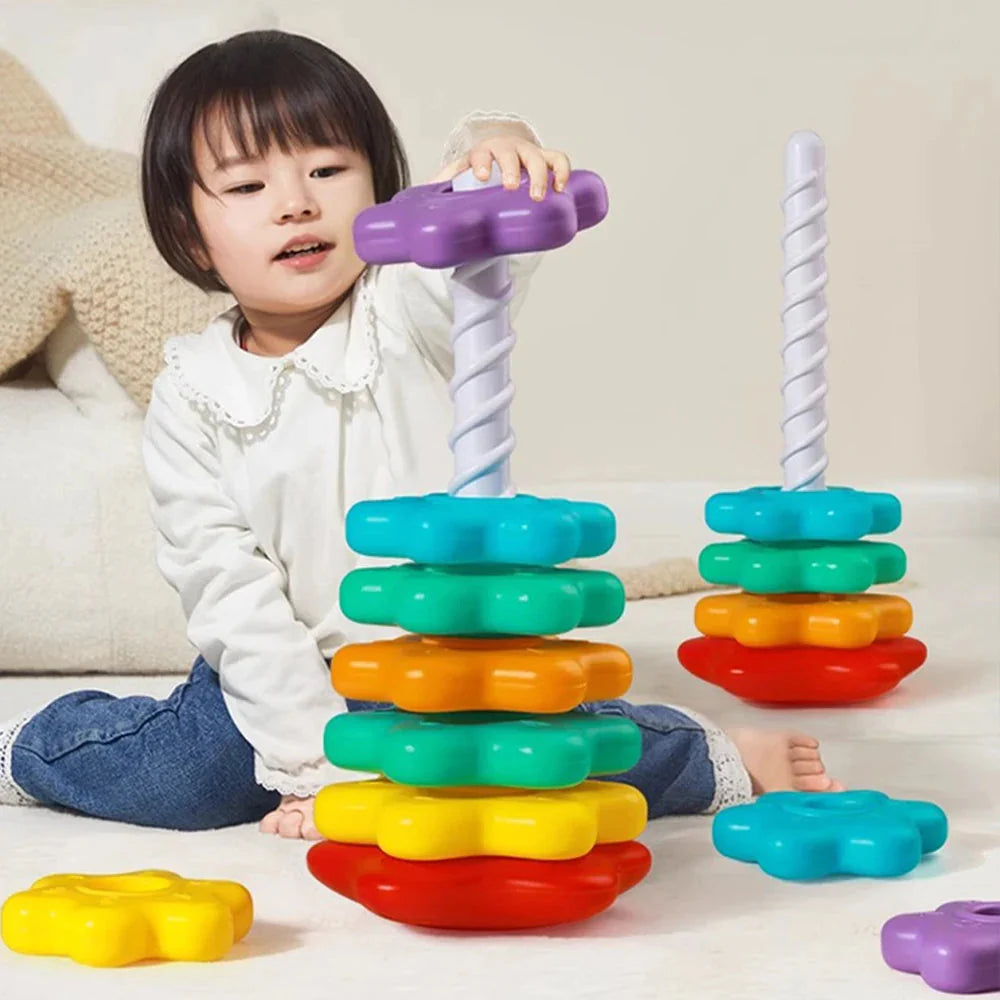 Baby exploring Montessori rainbow stacking toy with bright colorful rings for sensory development