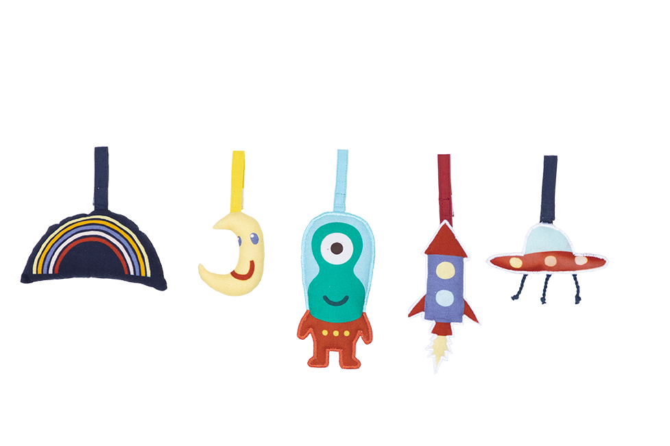 Sensory hanging toys included with Under the Stars baby play gym — moon, rocket, and star shapes