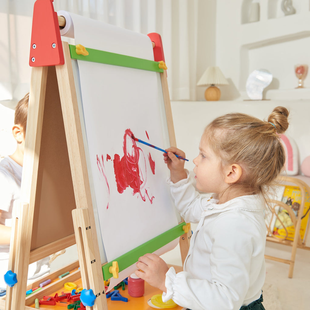 Child painting on Tiny Land art easel outdoors
Tiny Land easel showing full set of drawing tools included