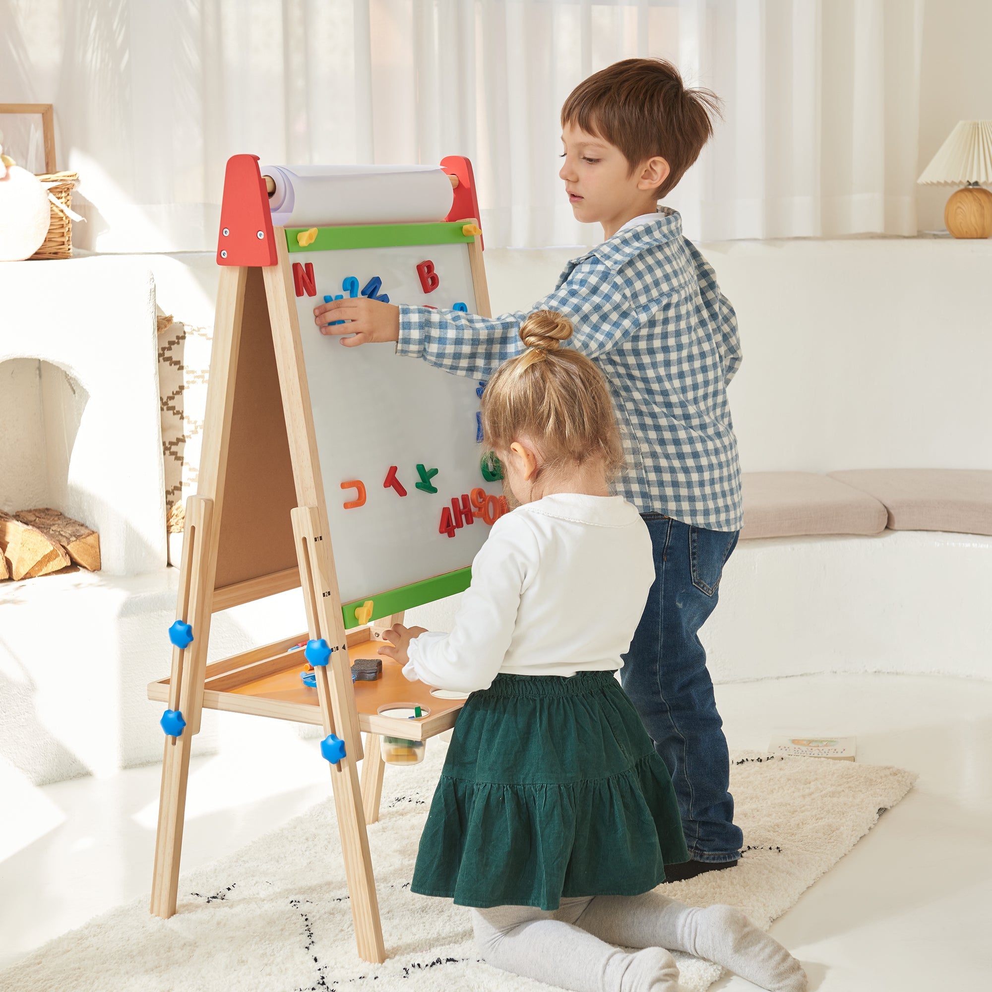 Child painting on Tiny Land art easel outdoors
Tiny Land easel showing full set of drawing tools included